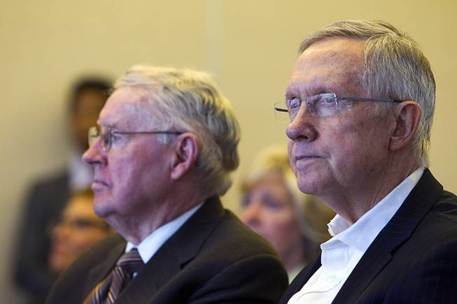 Judge Lloyd D. George, left, U.S. District Judge for the District of Nevada, and Senate Majority Leader Harry Reid (D-NV) attend a news conference marking the creation of the Tule Springs National Monument at the Las Vegas Paiute Resort northwest of Las Vegas, Monday, Dec. 22, 2014. The 22,650 acre site on the northern edge of the Las Vegas Valley features fossils from the Ice Age, including mammoths, bison, American Lions, camelops and sloths.