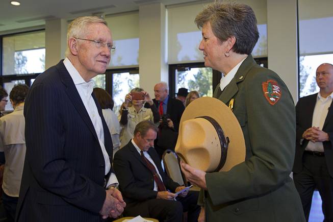 Senate Majority Leader Harry Reid (D-NV) speaks with Chris Lehnertz, Pacific West regional director for the National Park Service, during a news conference marking the creation of the Tule Springs National Monument at the Las Vegas Paiute Resort northwest of Las Vegas, Monday, Dec. 22, 2014. The 22,650 acre site on the northern edge of the Las Vegas Valley features fossils from the Ice Age, including mammoths, bison, American Lions, camelops and sloths.