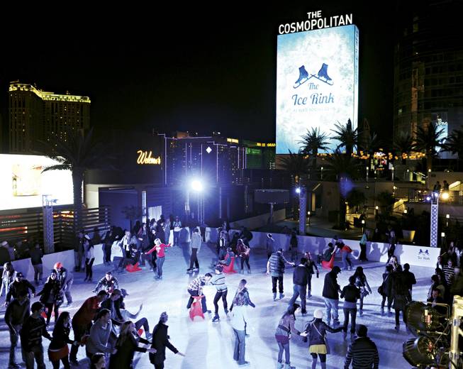 Skaters glide on the Cosmopolitan's ice rink Dec. 5, 2012, in Las Vegas. The resort turns its Boulevard pool into an ice rink during the holiday season. 