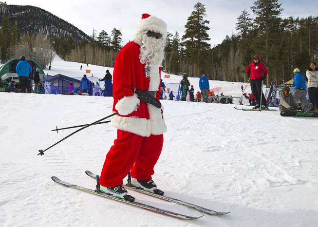 Santa skis on the bunny slope at the Las Vegas Ski and Snowboard Resort in Lee Canyon Wednesday, Dec. 24, 2014.