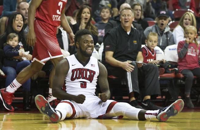 UNLV guard Jordan Cornish (3) smiles from the floor after a foul call from Southern Utah during their game at the Thomas & Mack Center on Saturday, December 27, 2014.