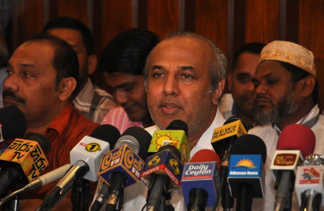 Leader of the Sri Lanka Muslim Congress Rauf Hakeem addresses the media in Colombo, Sri Lanka, on Saturday, Dec. 28, 2014. Hakeem resigned as Justice Minister of the incumbent president Mahinda Rajapaksa 's government and announced his party will support the opposition candidate in the upcoming presidential election.