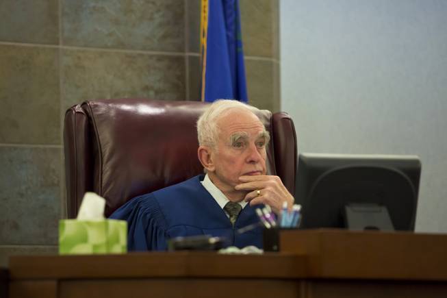 Justice of the Peace William Jansen listens to testimony during the preliminary hearing of Galina Stoyanova Kilova at the Regional Justice Center, Wed. Dec. 31, 2014. Kilova is accused in a hit-and-run on Nov. 24 that killed 63-year-old Michael Grubbs and injured his 18-month-old granddaughter.