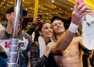 Donald Cerrone poses with fans during the open workout for UFC 182 Wednesday, December 31, 2014 at the MGM Grand in Las Vegas, Nev.