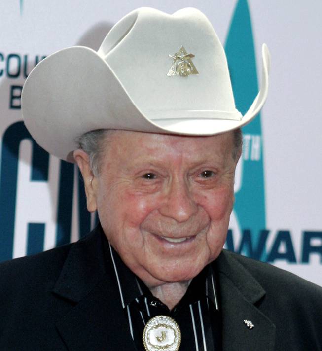 FILE - In this Nov. 6, 2006 file photo, Grand Ole Opry star Little Jimmy Dickens arrives at the 40th Annual CMA Awards in Nashville, Tenn. Dickens has been hospitalized with an undisclosed illness. Jessie Schmidt, a publicist for the Opry, said in a news release Sunday, Dec. 28, 2014, that Dickens was admitted to a Nashville-area hospital on Dec. 25 and that he's in "critical care." 