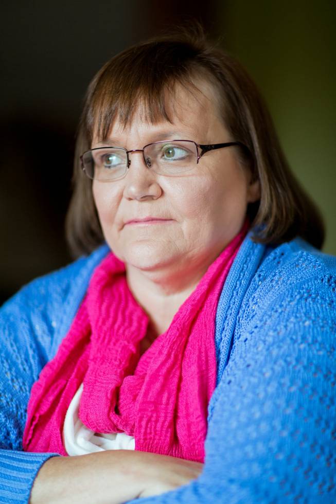 Jan Lastocy poses for a photo at home in Belmont, Mich., on July 2, 2014. Lastocy was imprisoned for embezzlement and then repeatedly raped by a male guard. When Congress passed a law in 2003 aimed at ending sexual assault in U.S. prisons, jails and juvenile detention centers, survivors like Lastocy were hopeful it would help solve the long-ignored problem. Now, some advocates worry that a proposal to reduce the law's financial penalties will severely damage it.