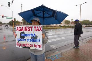 Lisa Mayo-DeRiso stands near the Smith's shopping center at Lake Mead and Rampart boulevards Sunday, Jan 11, 2015. DeRiso said she is pro-soccer but doesn't want the city to spend park money on a private stadium.