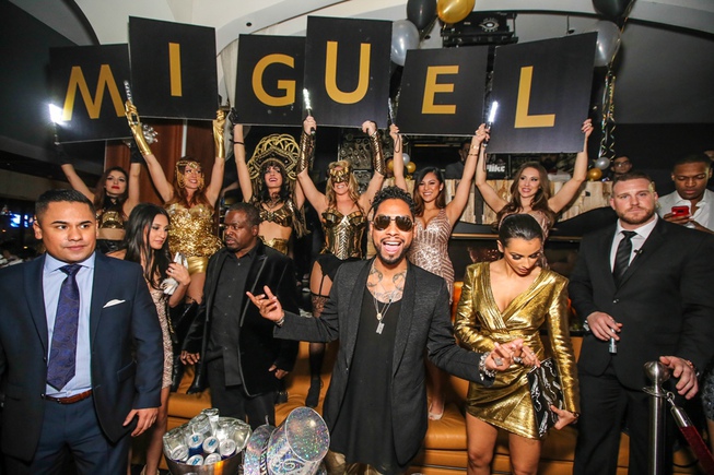 Miguel, with girlfriend Nazanin Mandi, hosts and performs Wednesday, Dec. ...