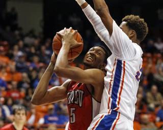 UNLV's Christian Wood (5) looks to the basket past as Boise State's James Webb III defends during the first half of an NCAA college basketball game in Boise, Idaho, Tuesday, Jan. 13, 2015. (AP Photo/Otto Kitsinger)