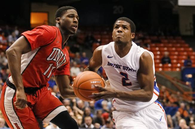 Boise State's Derrick Marks heads past UNLV's Goodluck Okonoboh during the second half in Boise, Idaho, on Tuesday, Jan. 13, 2015. Boise State won 82-73 in overtime.