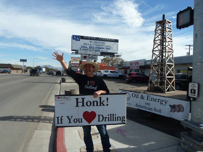 George Burnett is an unapologetic supporter of the oil companies in Vernal, Utah. Often he stands outside his business with signs urging residents to show their support as well.