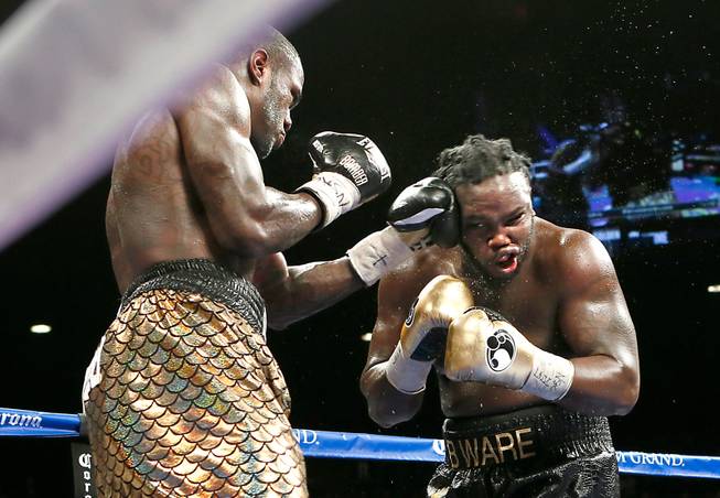 Deontay Wilder, left, connects on Bermane Stiverne during their WBC Heavyweight fight at the MGM Grand Garden Arena on Saturday, January 17, 2015.