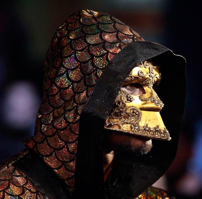 Deontay Wilder walks towards the ring wearing a golden mask before his WBC Heavyweight fight at the MGM Grand Garden Arena on Saturday, January 17, 2015.