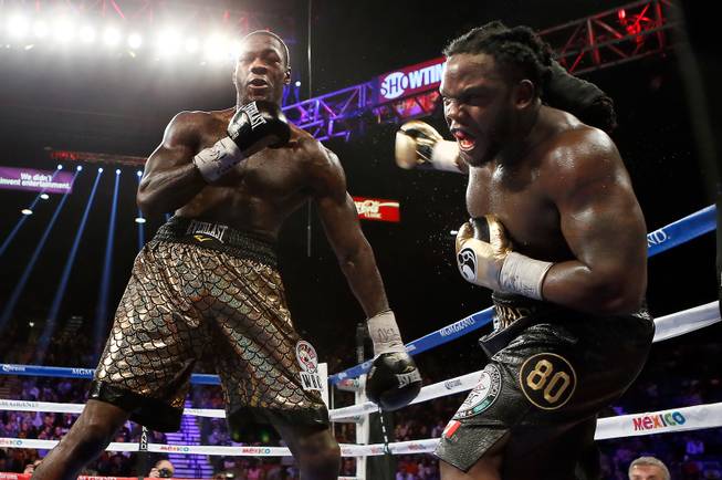 Deontay Wilder connects on Bermane Stiverne who falls back during their WBC Heavyweight fight at the MGM Grand Garden Arena on Saturday, January 17, 2015.