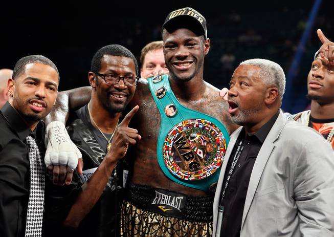Deontay Wilder celebrates the win with his team over Bermane Stiverne following their WBC Heavyweight fight at the MGM Grand Garden Arena on Saturday, January 17, 2015.