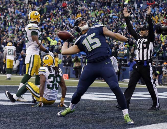 Seattle Seahawks' Jermaine Kearse celebrates after catching the game-winning touchdown during overtime of the NFC Championship game against the Green Bay Packers on Sunday, Jan. 18, 2015, in Seattle. The Seahawks won 28-22 to advance to Super Bowl XLIX.