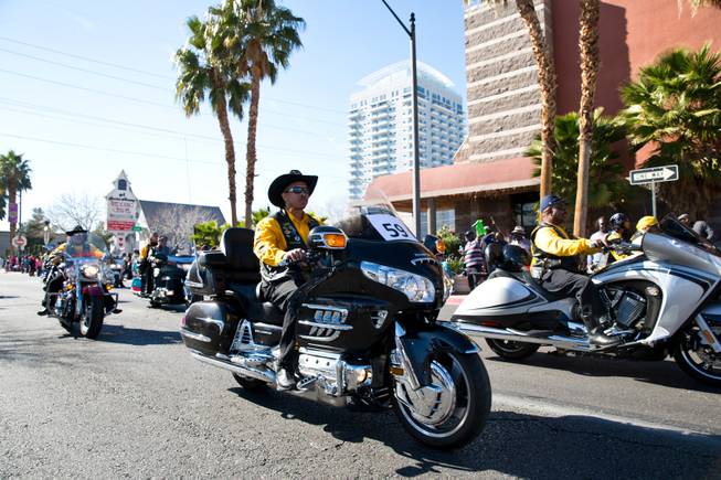 Members of the Las Vegas chapter Buffalo Soldiers ride down Fourth Street during the 33rd Annual Dr. Martin Luther King Jr. Parade in downtown Las Vegas, Monday Jan. 19, 2015.