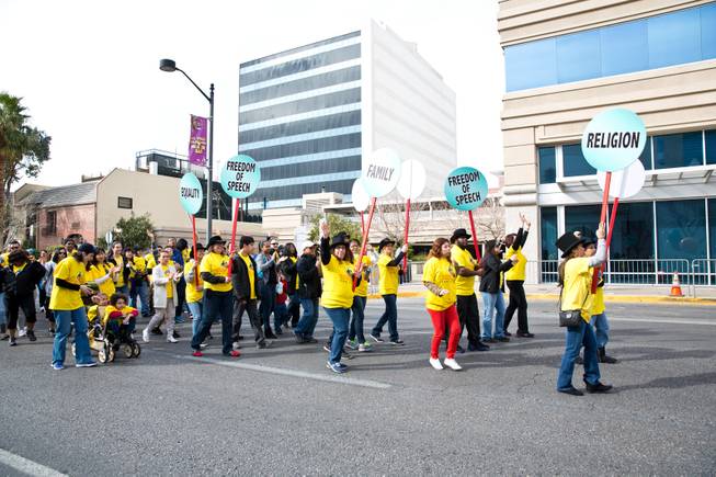 Employees at MGM Resorts International march in the 33rd Annual Dr. Martin Luther King Jr. Parade in downtown Las Vegas, Monday Jan. 19, 2015.