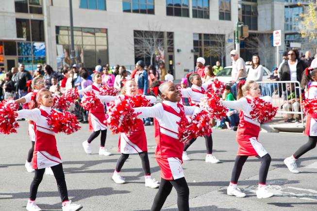 Cheerleaders from Booker Elementary School march in the 33rd Annual Dr. Martin Luther King Jr. Parade in downtown Las Vegas, Monday Jan. 19, 2015.