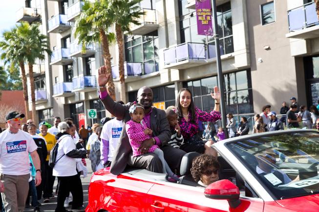 Councilman Ricki Barlow, and family, wave to the crowd during the 33rd Annual Dr. Martin Luther King Jr. Parade in downtown Las Vegas, Monday Jan. 19, 2015.