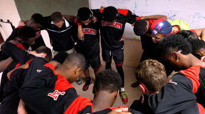 Las Vegas High players come together for a prayer before leaving their locker room to face Valley View on the basketball court as rivalries on Tuesday, January 20, 2015.