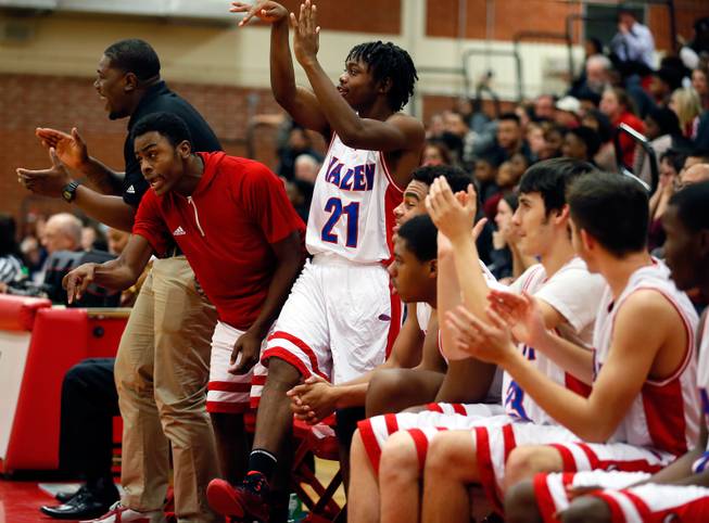 The Valley High bench is excited about the lead over Las Vegas High during their rivals basketball game on Tuesday, January 20, 2015.