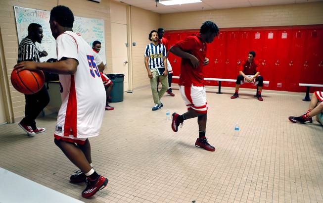 Valley High players dance around their locker room getting pumped up to face Las Vegas High on the basketball court as rivalries on Tuesday, January 20, 2015.
