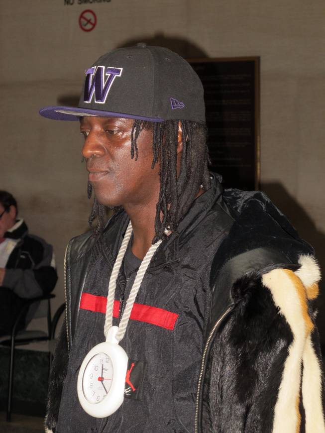 Rapper and reality TV star Flavor Flav leaves following his arraignment on traffic charges in Nassau County Court in Mineola, N.Y., on Wednesday, Jan. 21, 2015. The rapper, whose real name is William Drayton, was arrested in January 2014 on speeding and other charges while driving to his mother's funeral.