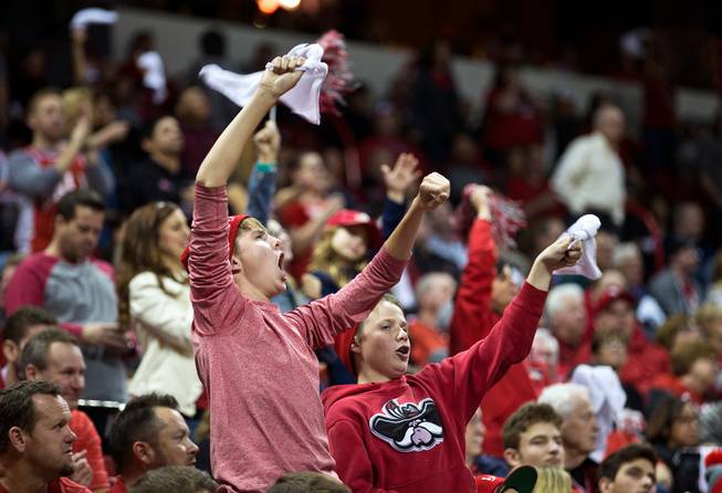 Fans wave white towels in support of UNLV during their game at the Thomas & Mack Center on Wednesday, January 21, 2015.