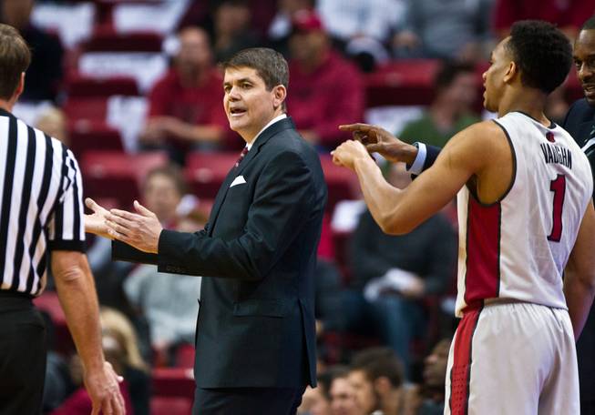 UNLV head coach Dave Rice argues a foul call with the official during their game at the Thomas & Mack Center on Wednesday, January 21, 2015.