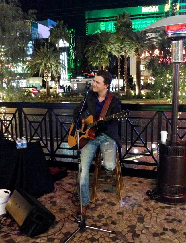 Las Vegas singer-songwriter Michael Grimm performs on Brooklyn Bridge at New York-New York on Sunday, Jan. 18, 2015.


