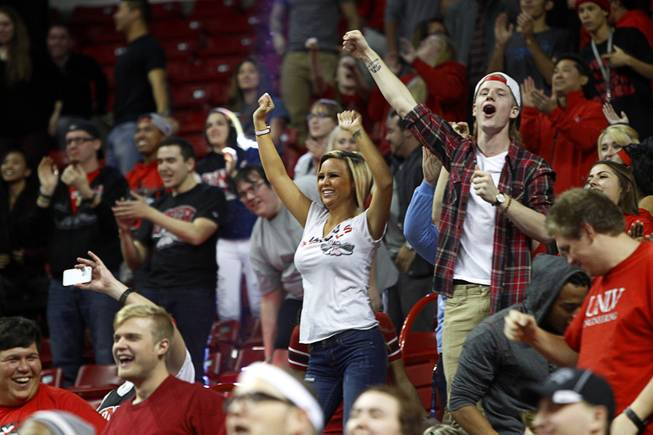 UNLV fans celebrate as the game goes into overtime Saturday, Jan. 24, 2015, at the Thomas & Mack Center.