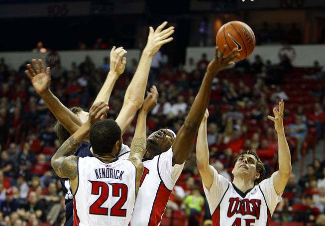 UNLV players jump for a rebound against Utah State at the Thomas & Mack Center Saturday, Jan. 24, 2015.