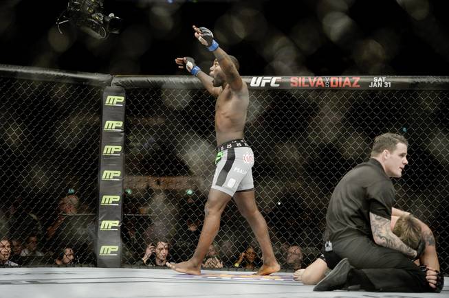Anthony "Rumble" Johnson, left, of the United States celebrates winning against Alexander "The Mauler" Gustafsson, right, in their UFC featherweight mixed martial arts bout at Tele2 Arena in Stockholm, Sweden, Saturday, Jan. 24, 2015.
