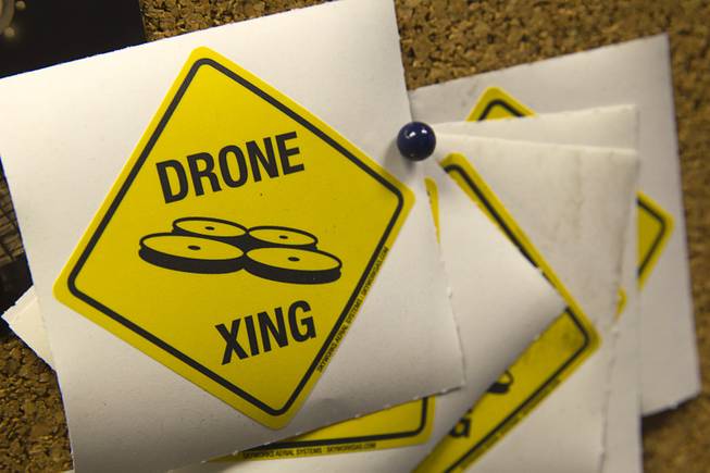 "Drone Xing" stickers are shown on a bulletin board at SkyWorks, a company producing research drones, in Henderson Monday, Jan. 26, 2015.