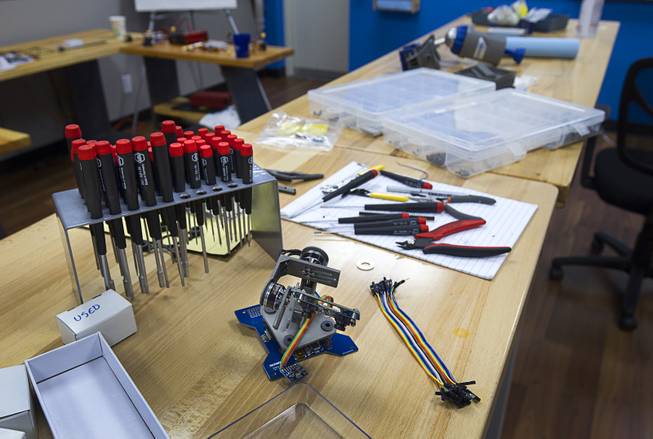 Parts and tools are shown on a work bench at SkyWorks, a company producing research drones, in Henderson Monday, Jan. 26, 2015.