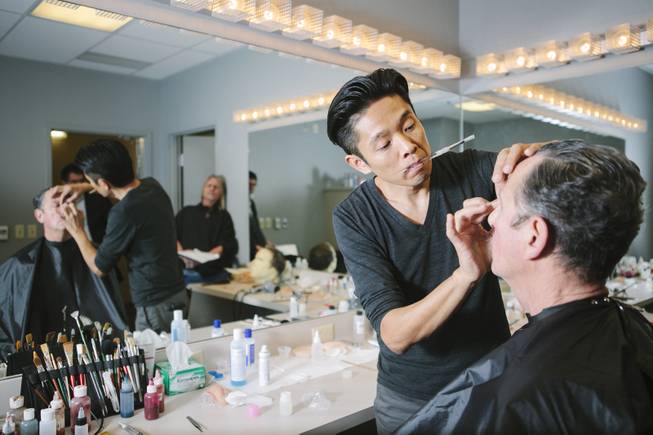 Kazu Tsuji works on the makeup for Bob Anderson, who plays Frank Sinatra in “Frank: The Man, The Music,” at Palazzo on Friday, Jan. 23, 2015, in Las Vegas.
