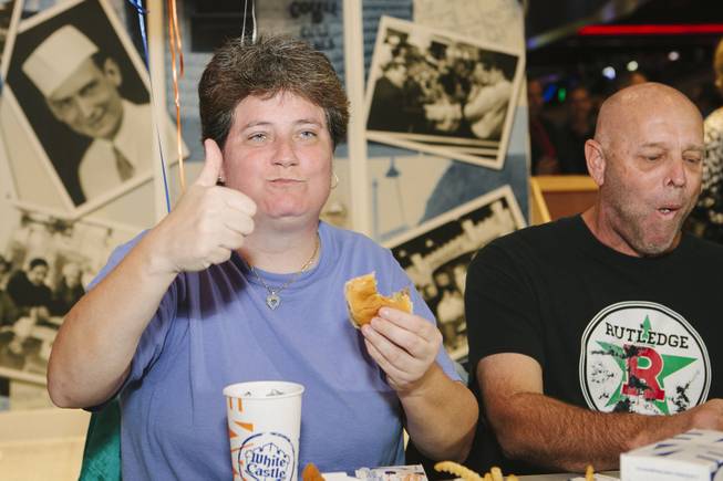 Linda Kitchel, left, and Newman are the first customers served at the grand opening of White Castle at the Best Western Plus Casino Royale on the Strip on Jan. 27, 2015.
