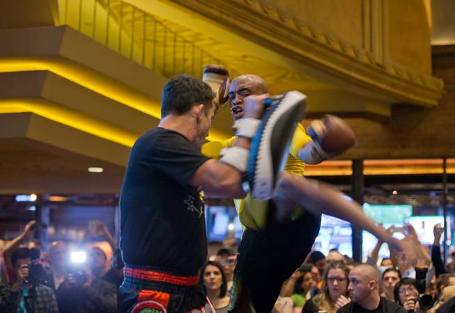 UFC 183 fighter Anderson Silva seta up for a lick during 'workouts' open to the public at the MGM Grand Casino floor on Wednesday, January 28, 2015.