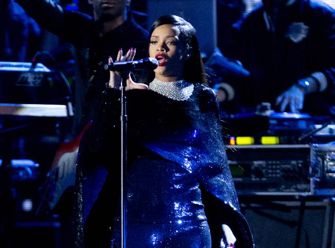 In this Nov. 11, 2014, photo, Rihanna performs at the National Mall in Washington, D.C., during the Concert for Valor. Rihanna will headline one of the weekend’s biggest private concerts, DirecTV’s Super Saturday Night, one of many events leading up to Sunday's Super Bowl. 