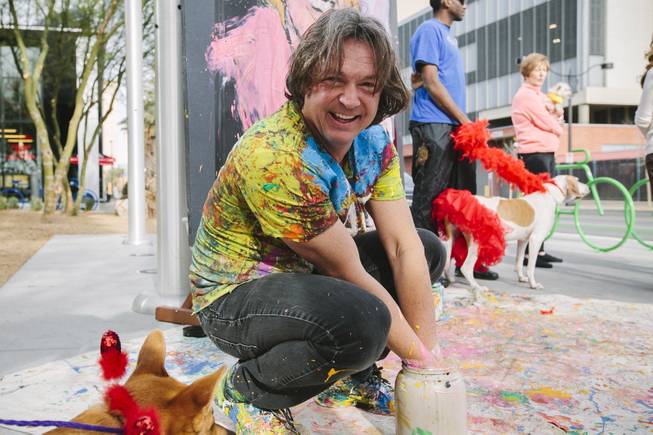 Jean Francois attends the ceremonial fire hydrant dedication for Keno, a Nevada SPCA foster puppy selected to take part in Puppy Bowl XI, which airs on Super Bowl Sunday, on Wednesday, Jan. 28, 2015. Francois created a painting to commemorate the occasion.