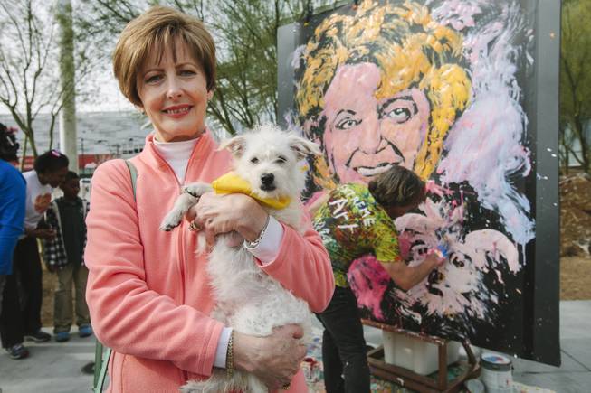 Marcia Mansell attends the ceremonial fire hydrant dedication for Keno, a Nevada SPCA foster puppy selected to take part in Puppy Bowl XI, which airs on Super Bowl Sunday, on Wednesday, Jan. 28, 2015. Mansell adopted Keno.