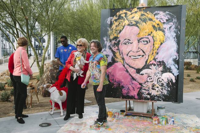 Mayor Carolyn Goodman, right, and Jean Francois attend the ceremonial fire hydrant dedication for Keno, a Nevada SPCA foster puppy selected to take part in Puppy Bowl XI, which airs on Super Bowl Sunday, on Wednesday, Jan. 28, 2015. Francois created a painting to commemorate the occasion.