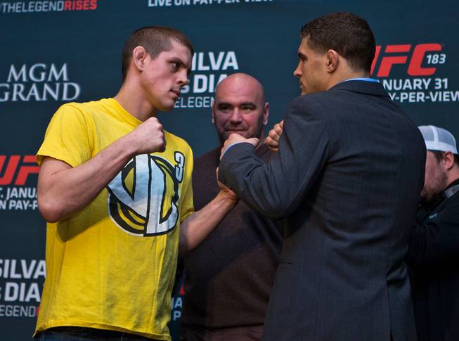 UFC lightweight Joe Lauzon faces off with Al Iaquinta during the UFC183 media day event on Thursday, January 29, 2015.