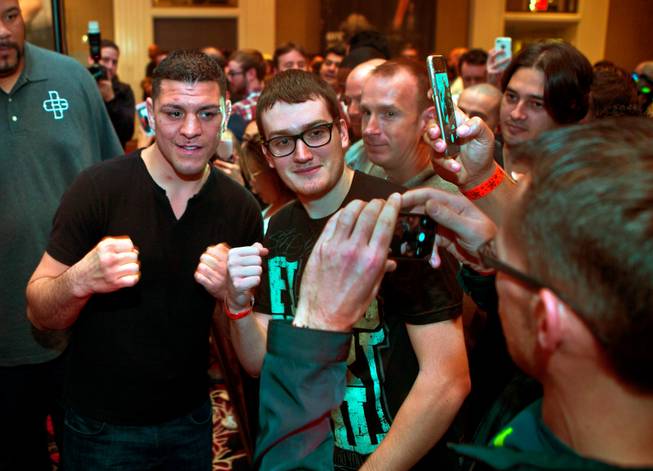 Featured UFC183 fighter Nick Diaz poses for pictures with fans during media day events at the MGM Grand on Thursday, January 29, 2015.
