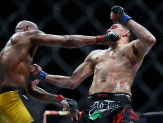 Middleweight Anderson Silva and Nick Diaz trade punches late in their fight at the MGM Grand Garden Arena on Saturday, Jan. 31, 2015. 