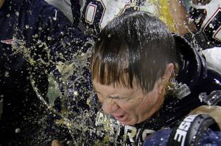 New England Patriots head coach Bill Belichick is doused by a sports drink after Super Bowl XLIX against the Seattle Seahawks on Sunday, Feb. 1, 2015, in Glendale, Ariz. The Patriots won 28-24.