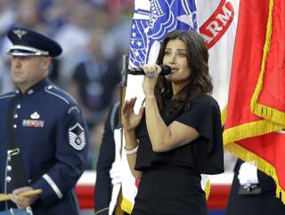 Idina Menzel sings the national anthem before Super Bowl XLIX between the Seattle Seahawks and the New England Patriots on Sunday, Feb. 1, 2015, in Glendale, Ariz.