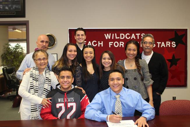Las Vegas linebacker Jacob Littlefield is joined by his family after signing a letter of intent with Air Force.