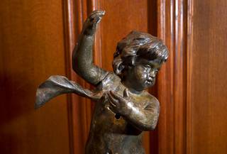 A new artifact, a bronze cherub, is shown before being installed at 